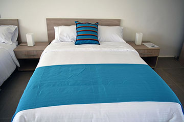 Double bed with fine linens